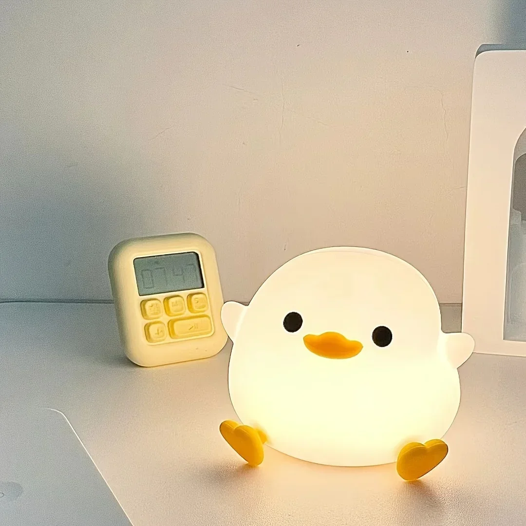 

Night Keeper-nightlight, the lovely Doudou Duck, on the bed in the bedroom. "