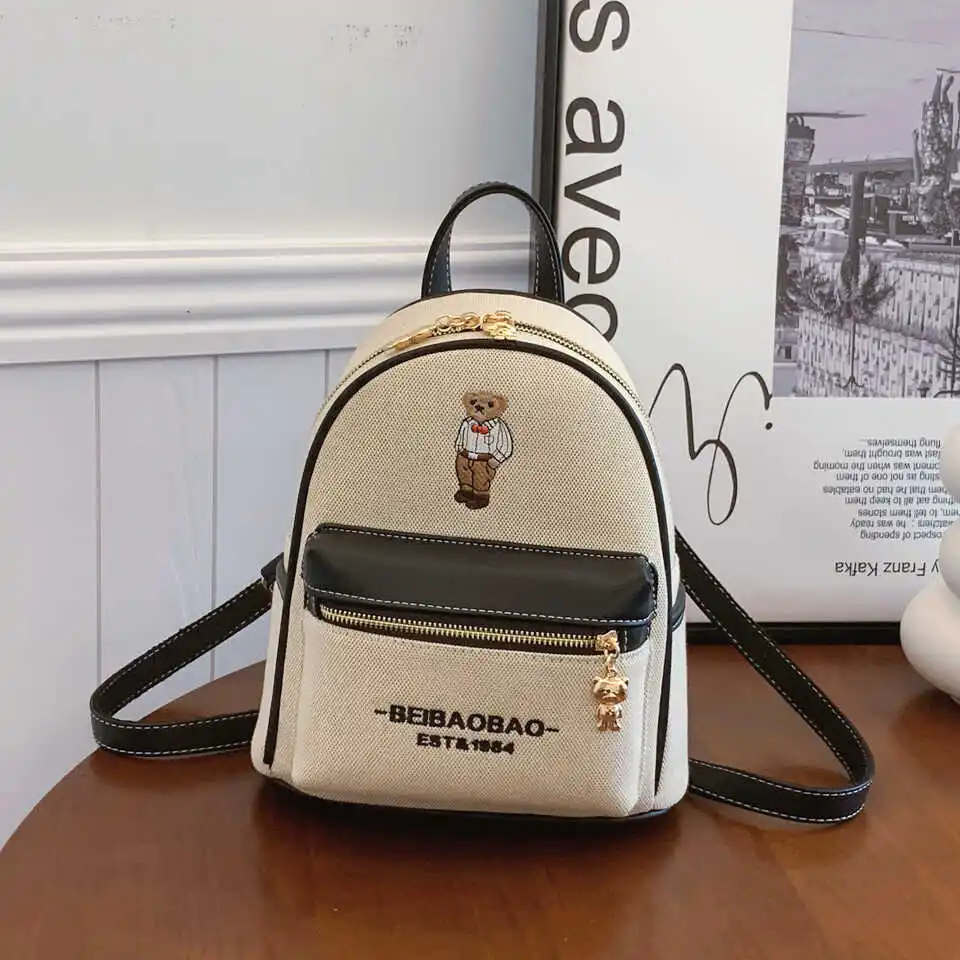 casual-canvas-bear-backpack-women's-bag-2026-new-cartoon-travel-bag-versatile-korean-fashion-shoulder-bag-commuter-style-poly
