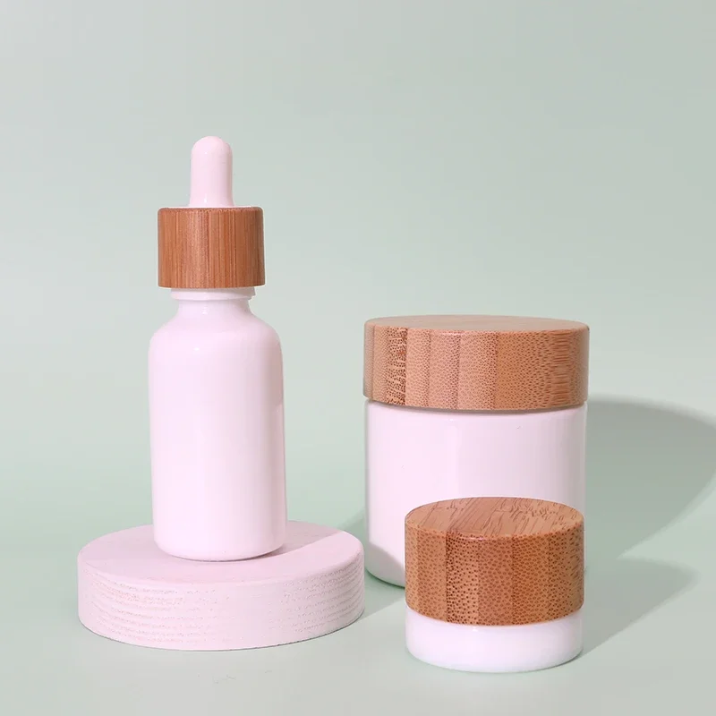 

Белая стеклянная банка 5 г с бамбуковой крышкой Бутылка эфирного масла 30 мл Белая стеклянная бутылка-капельница с бамбуковой крышкой Бамбуковый крем для хранения