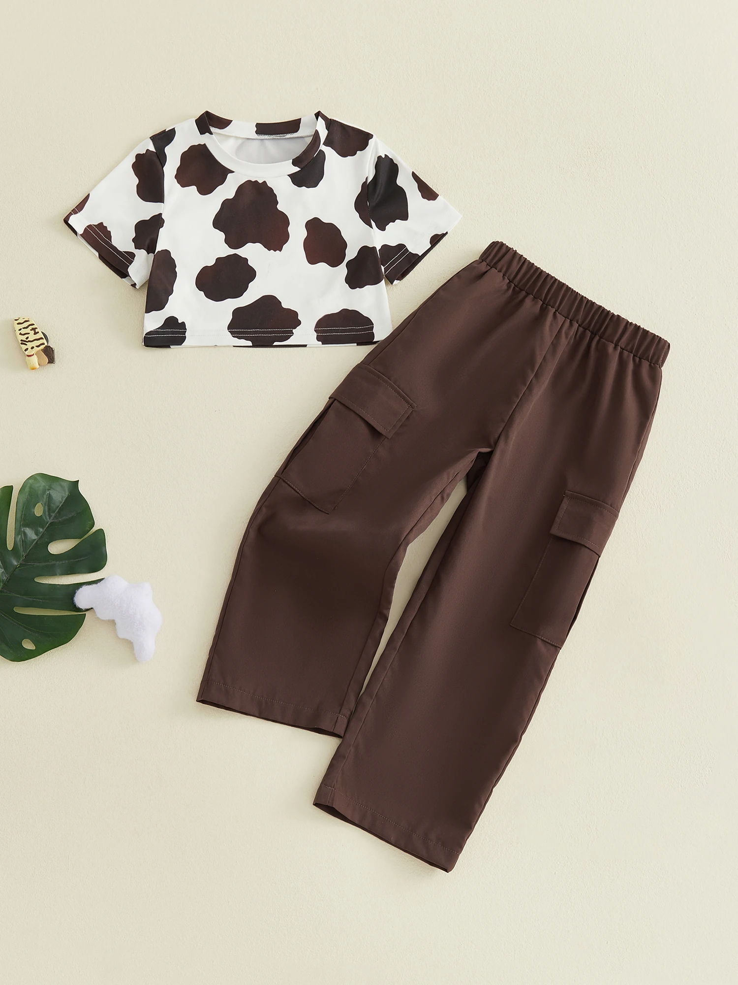 

Stylish Girls Summer Ensemble Trendy Short Sleeve Cow Print Crop Top paired with Cargo Pants for a Fashionable Look