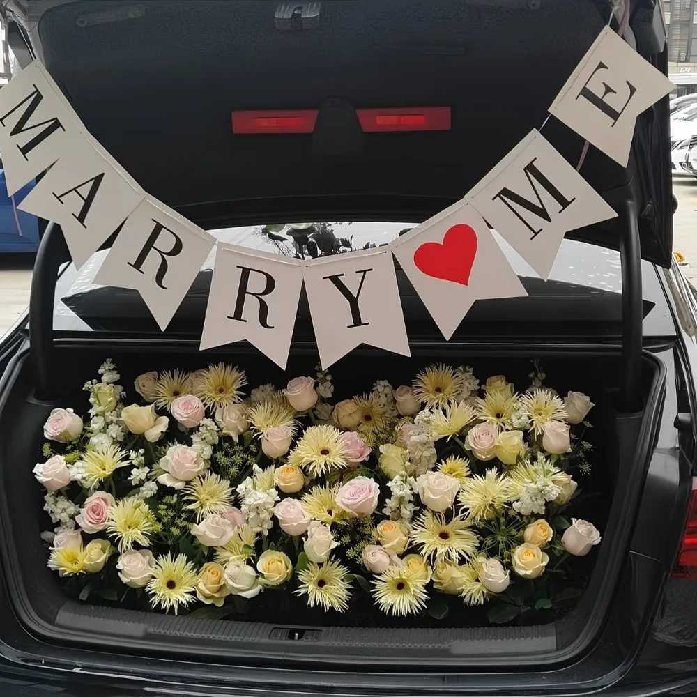 

Banner That Says 'Will You Marry Me' on a White Cardboard with Black Letters, Featuring a Tail Design for Hanging. Perfect for