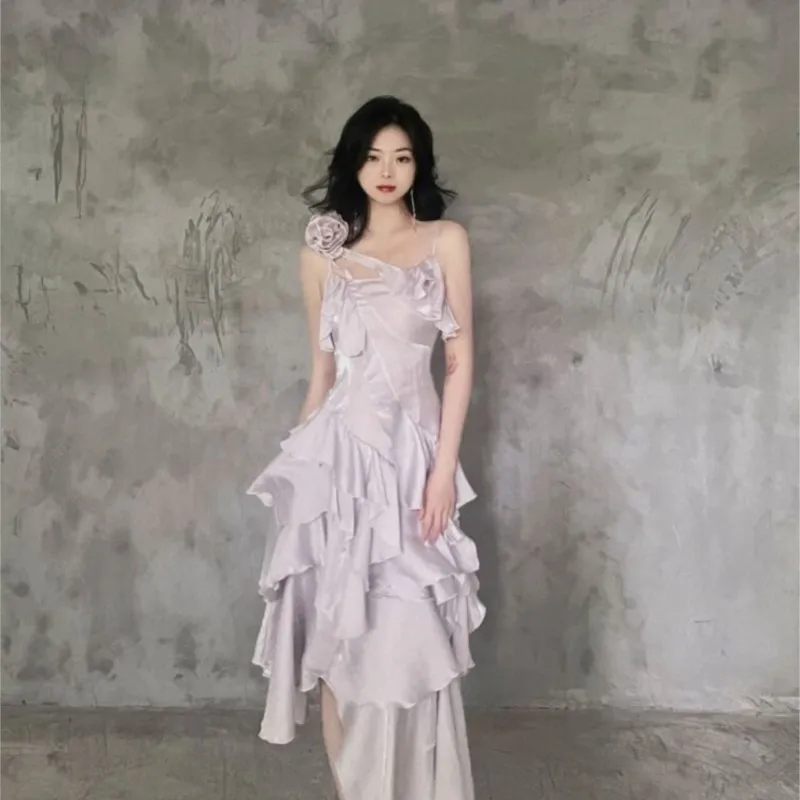 

An unconventional rose dress with irregular ruffled edges and a detachable design