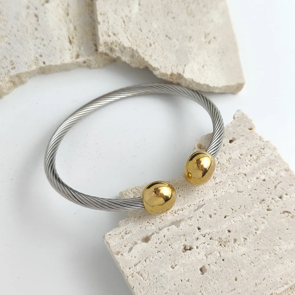 Double ball gold-plated stainless steel bracelet, twisted steel wire C-shaped design, classic fashion jewelry