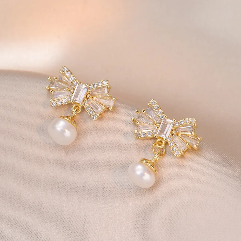 

Fashion sweet S925 silver needle bowknot natural freshwater pearl earrings for women