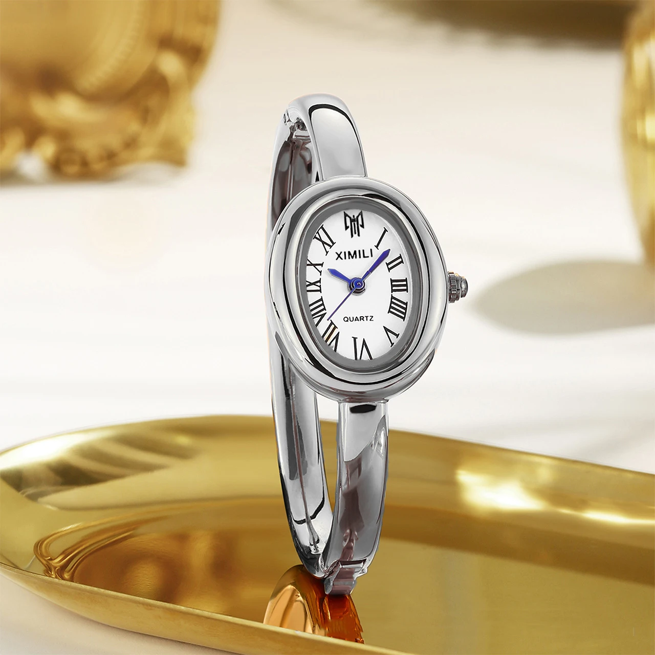 นาฬิกาข้อมือผู้หญิง ดีไซน์หรูหรา สายสแตนเลส แบรนด์ดัง หน้าปัดทรงรีเล็ก ตัวเลขโรมัน ระบบควอตซ์