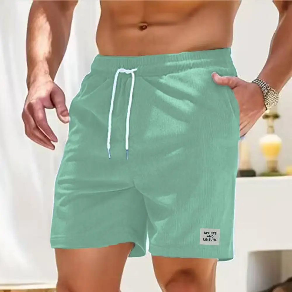 Pantaloni della tuta estivi nuovi pantaloni corti in velluto a coste con lacci pantaloncini da uomo semplici pantaloni a righe atletiche Casual