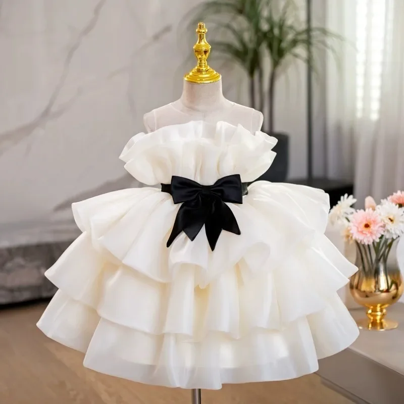 Abito da principessa in organza bianca per ragazze con volant a strati Abito da festa senza maniche con fiocco nero Perfetto per la ragazza di fiori di matrimonio di compleanno