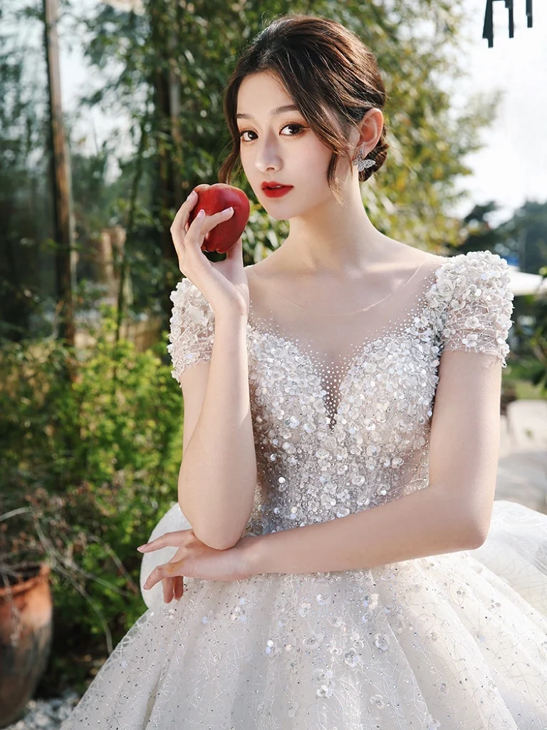 

Elegant Wedding Dresses Illusion O Neck Crystal A Line Applique Beading Princess Sweep Train Ruffle White Bridal Gowns