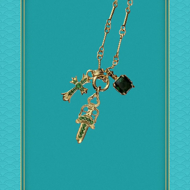 

Gold-Tone Multi-Pendant Necklace (Cross, Sword & Emerald Crystal)