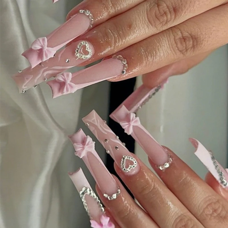

24Pcs Glamorous Long False Nails Shimmery Pink Ballet Style with 3D Crystal Bow&Heart French Tips Ideal for Girls Party Nail Art