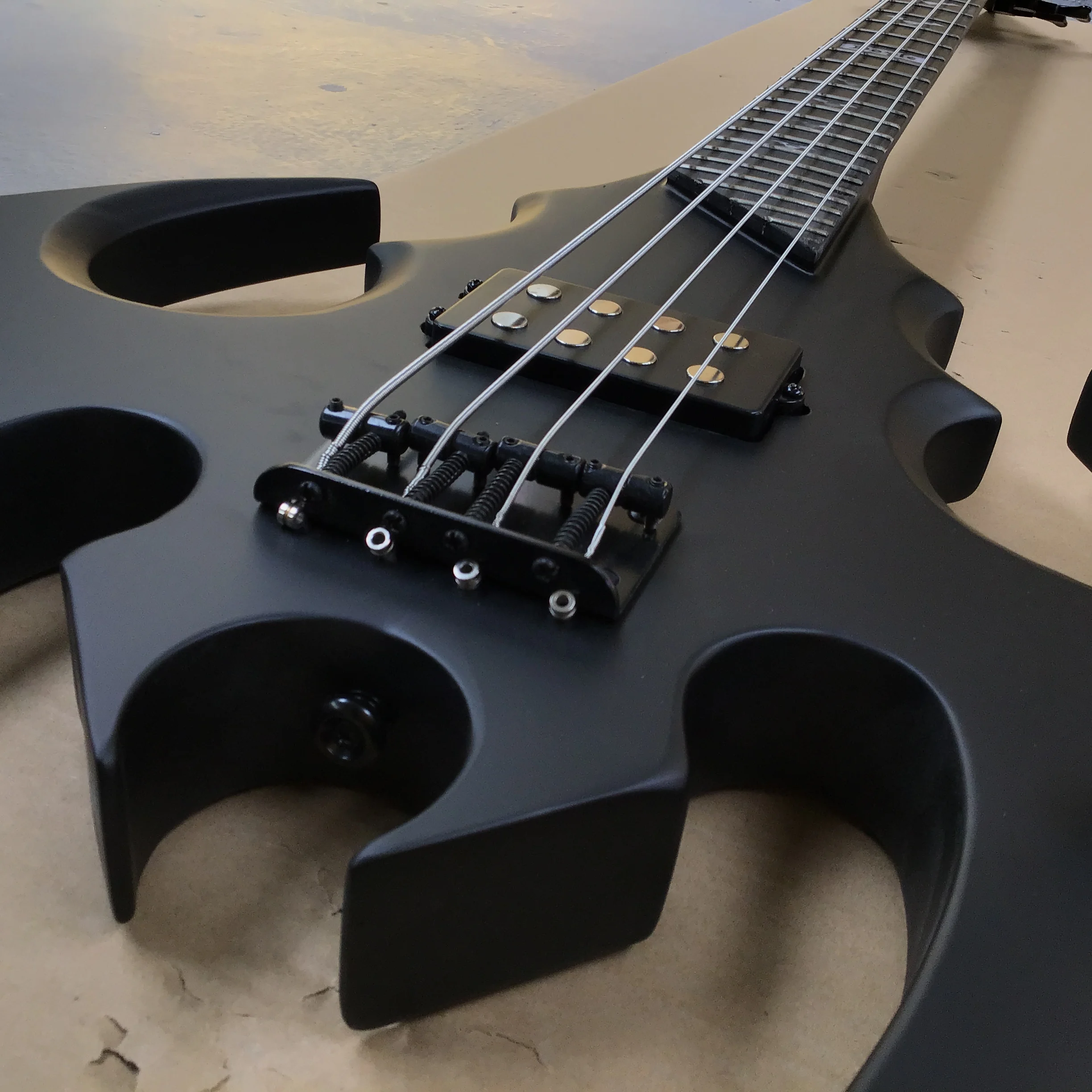 

hot sales irregularity Bat shape 4-string electric bass guitar, perfect tone black hardware hot sale in stock customizable