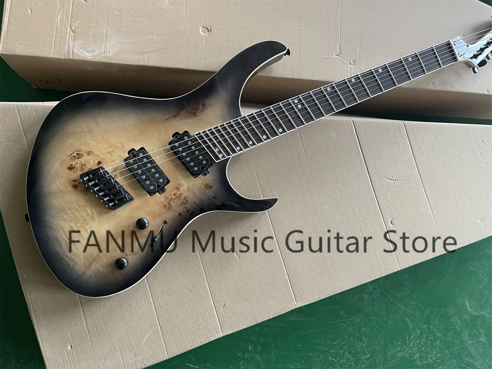 Transp black guitar, ash wood body, tree burl top, white binding, rosewood fingerboard, fixed bridge, black tuner