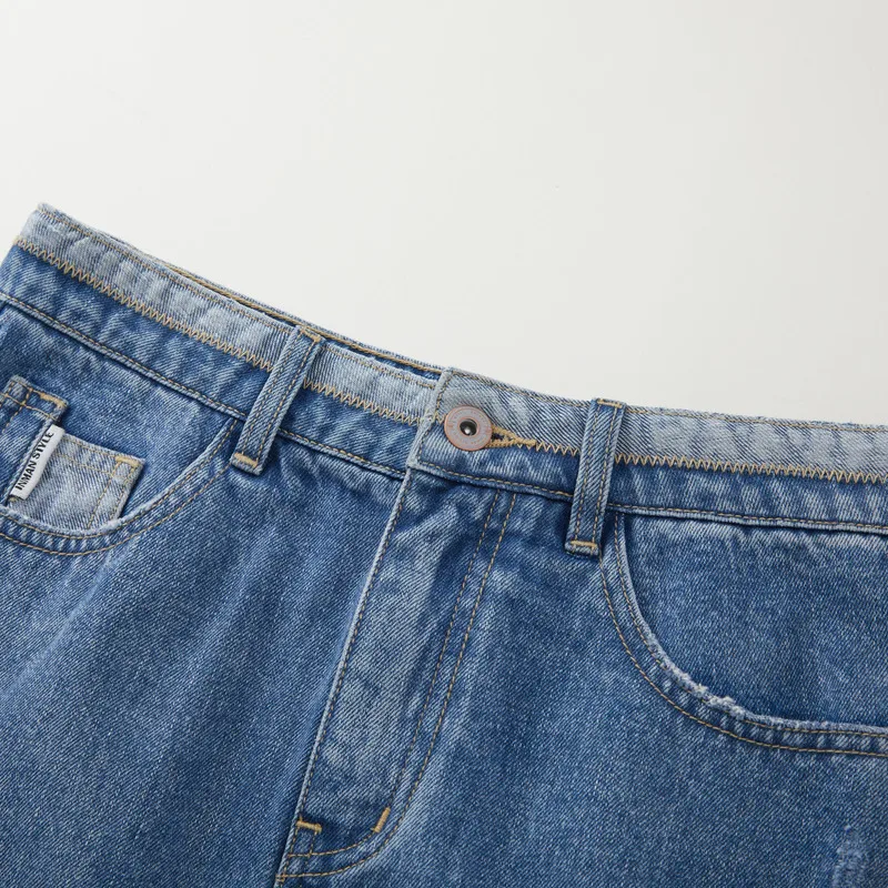 INMAN-saia jeans em forma de um para mulheres, design irregular, moda de bolso, versátil, casual, todos os fósforos, minissaia azul, verão, 2023