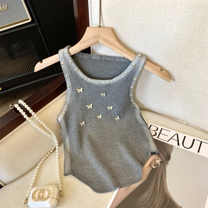 Elegante maglione lavorato a maglia sottile gilet donna 2024 estate Sexy Streetwear moda Chic farfalla rivetti Crop top senza maniche t-shirt da