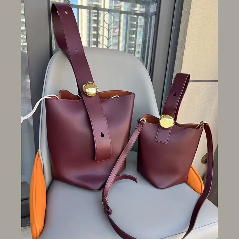 Bolsos de lujo de diseñador para mujer, bolsos de hombro, bolso de lujo para mujer, bolso tipo cubo de cuero genuino, bolso de mano con envío 2025, bolso de mano para mujer