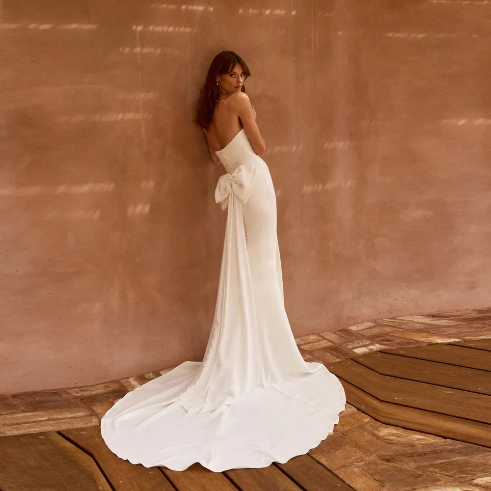 Suknia ślubna syrena w nowoczesnym stylu na zamówienie 2025, elegancka, na ramiączkach spaghetti, z kokardą i guzikami, seksowna suknia dla panny młodej.