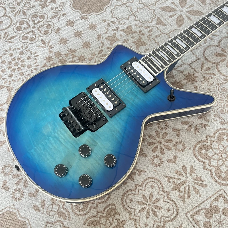 High-quality electric guitar, oddly shaped guitar, blue tiger stripe veneer, double locking tremolo, black hardware, in stock