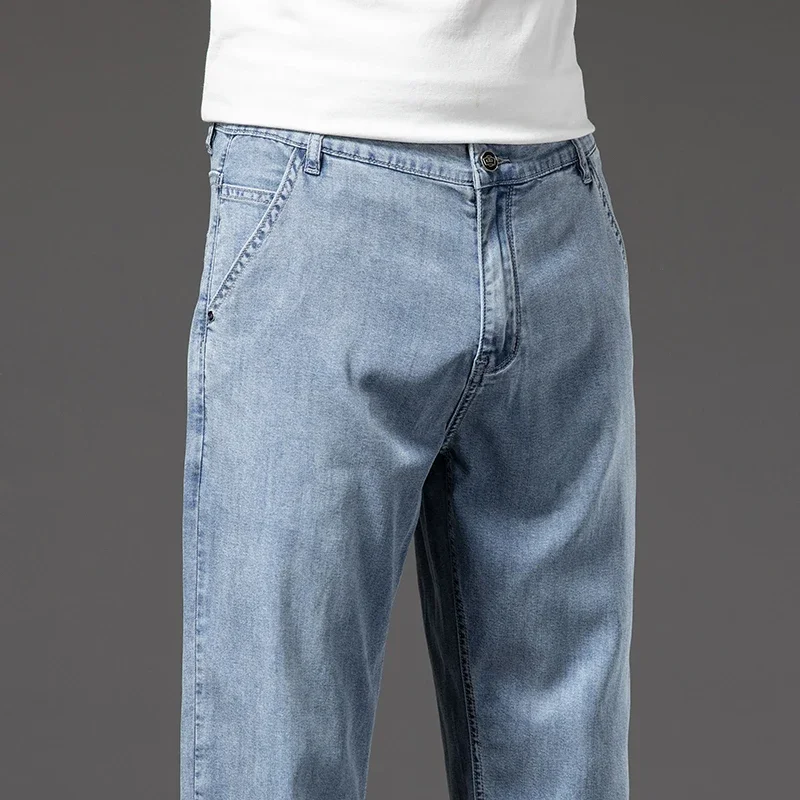 Jeans da uomo morbidi e sottili Lyocell pantaloni Casual larghi dritti di colore chiaro pantaloni di Jeans di elasticità dei vestiti maschili di moda aziendale