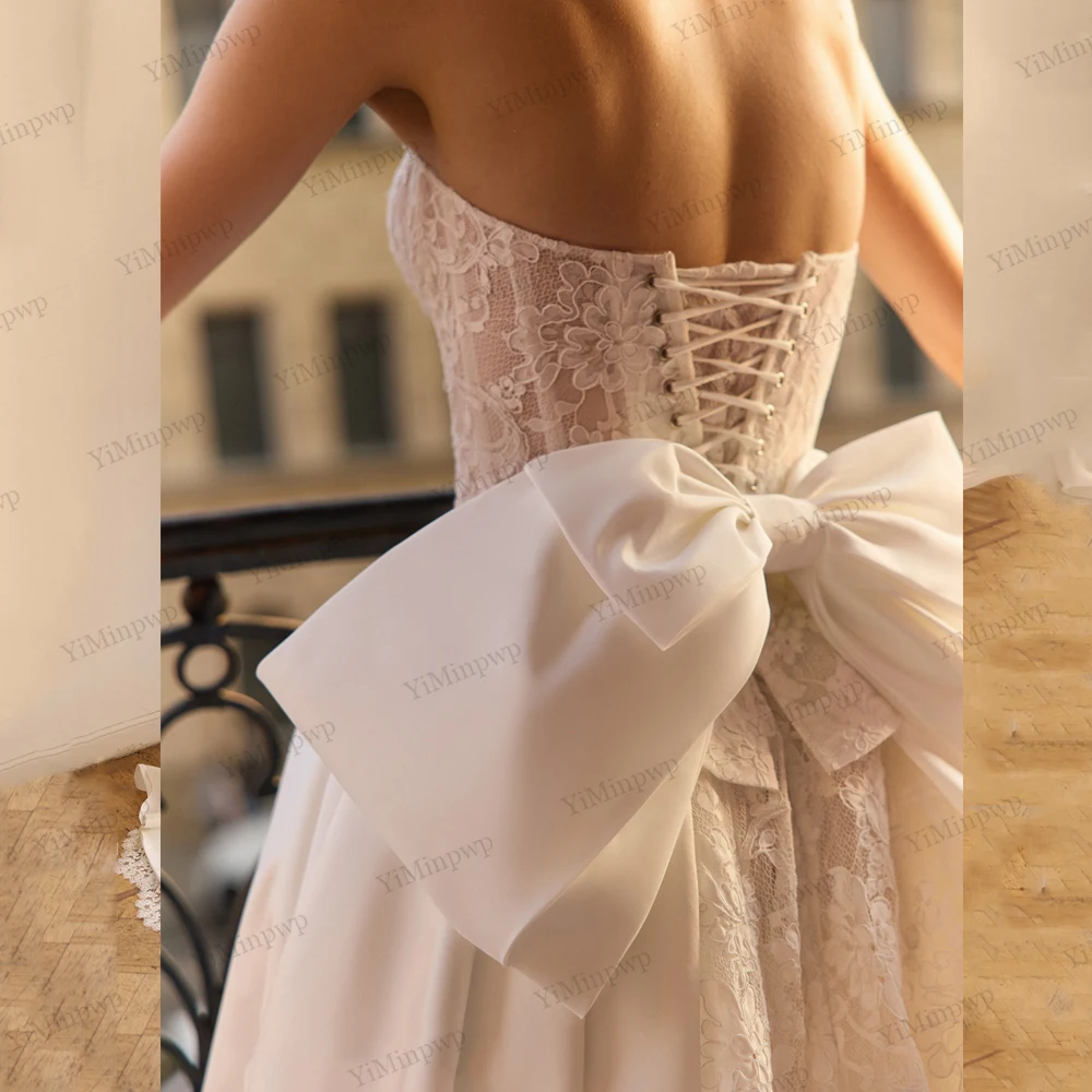 فساتين زفاف عتيقة مع فيونكة بدون حمالات على شكل حرف a فيستدو دي نوفيا بودا مزينة بدون أكمام وأربطة فساتين العروس حسب الطلب