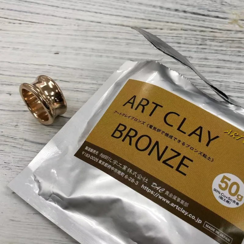 Materiales de producción para regalos: Arcilla de cobre/bronce metálico con grano de madera, oro, artesanía hecha a mano, decoración de arcilla de cobre, colgante de anillo para pareja