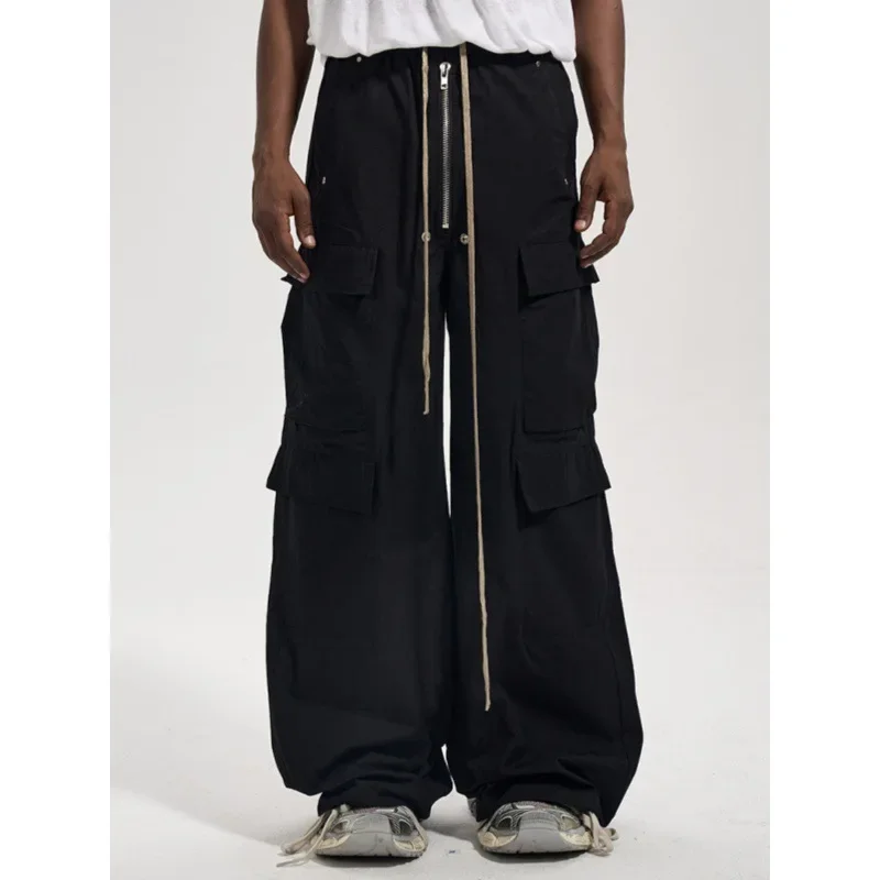 2024 High Street Vintage con cremallera bolsillo lateral pantalones casuales sueltos para hombres ropa de trabajo holgada pantalones acampanados ropa de calle negro