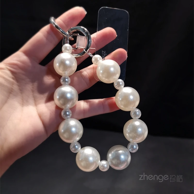 

Short pearl bead mobile phone lanyard, women's fashionable outdoor anti loss handheld wrist lanyard