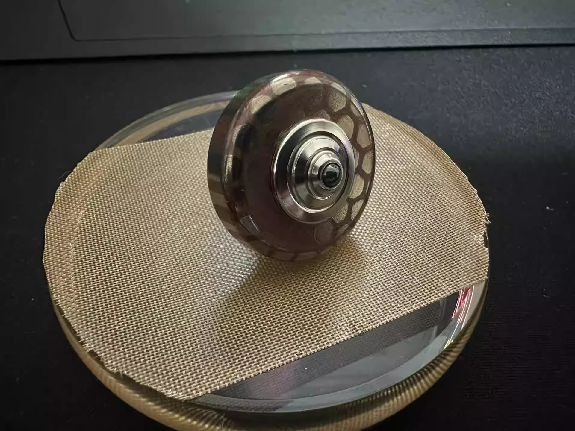 Superconducting hand twisted gyroscope with glass base