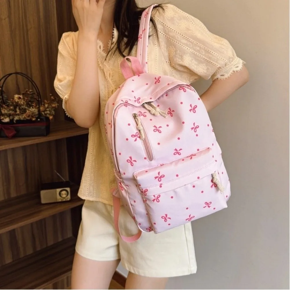 حقيبة ظهر لطيفة متعددة الجيوب مطبوعة على شكل فيونكة ذات سعة كبيرة من النايلون حقائب مدرسية بأشرطة قابلة للتعديل حقيبة كتب للاستخدام اليومي