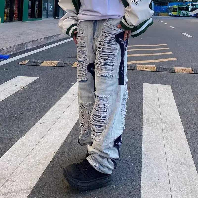 High Street Hip Hop Cuciture strappate Jeans decostruiti Design Sense Pantaloni a gamba dritta con toppa vintage Uomo Donna