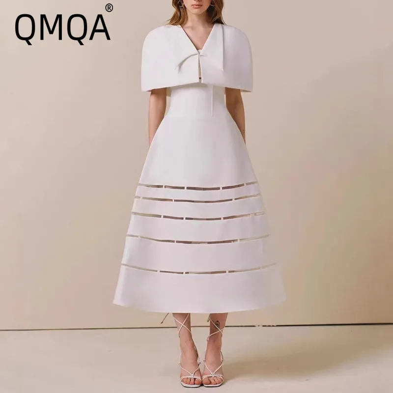 QMQA فستان نسائي أنيق مجوف بتصميم كيب عالي الخصر بلون واحد فساتين قصيرة 2025 أنثى QM692