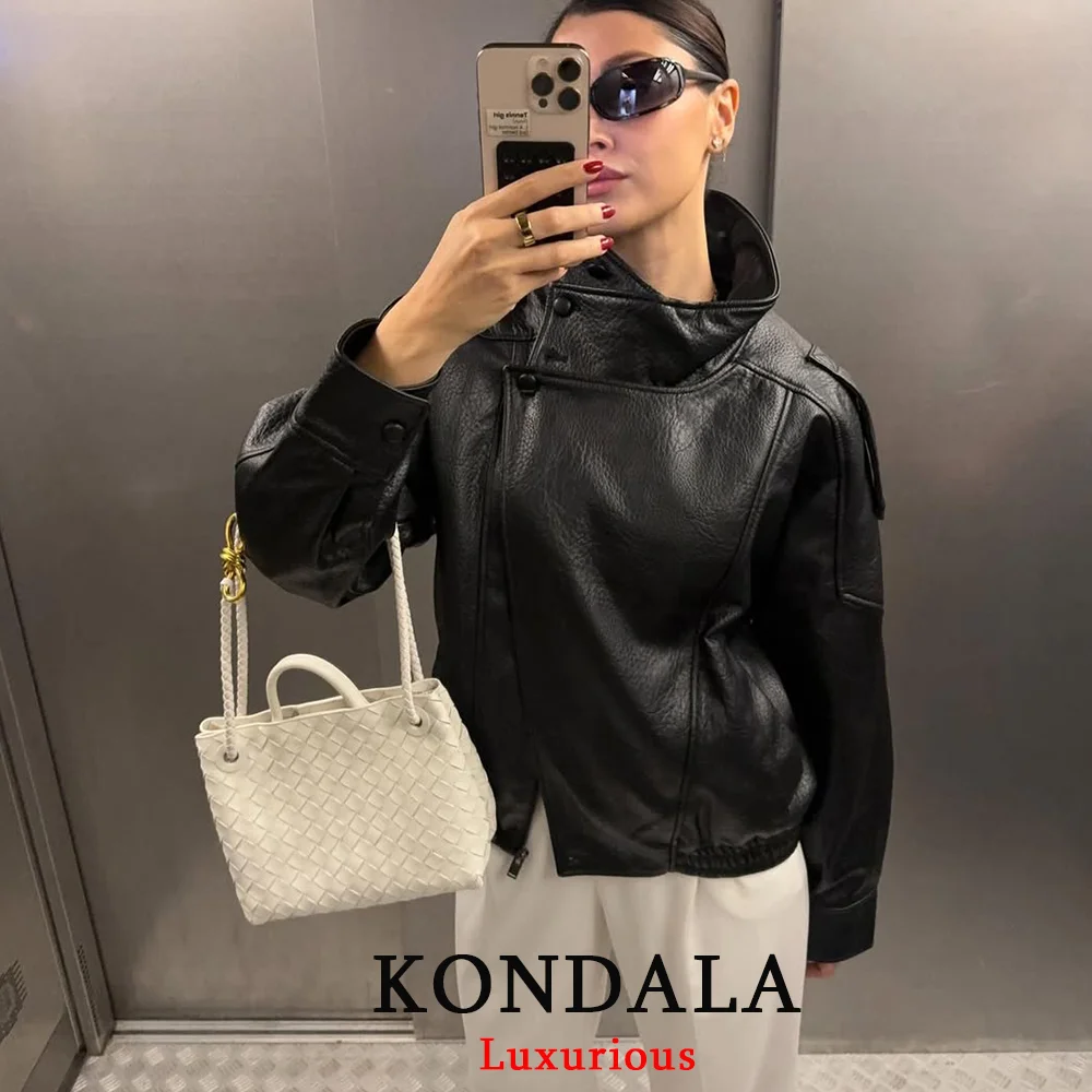 KONDALA سترات جلدية سوداء أنيقة غير رسمية للنساء بأكمام طويلة وأزرار معاطف مرنة كبيرة الحجم موضة خريف 2025 معاطف ملابس الشارع الشهير
