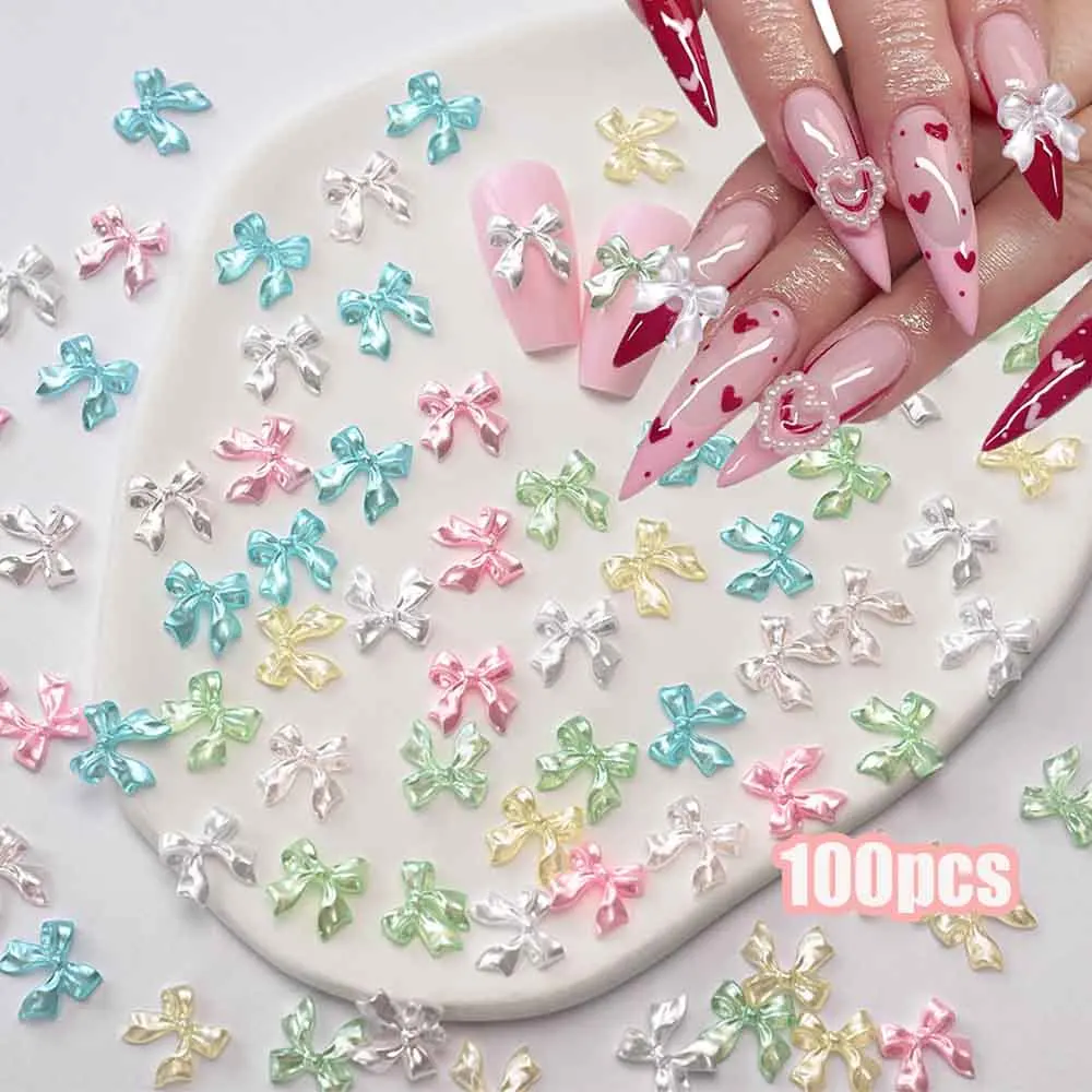100 pièces couleur perle rose/blanc ruban nœud breloques pour ongles pièces Kawaii Aurora noeud papillon bijoux pour ongles 10*10mm décoration Nail Art Accesso