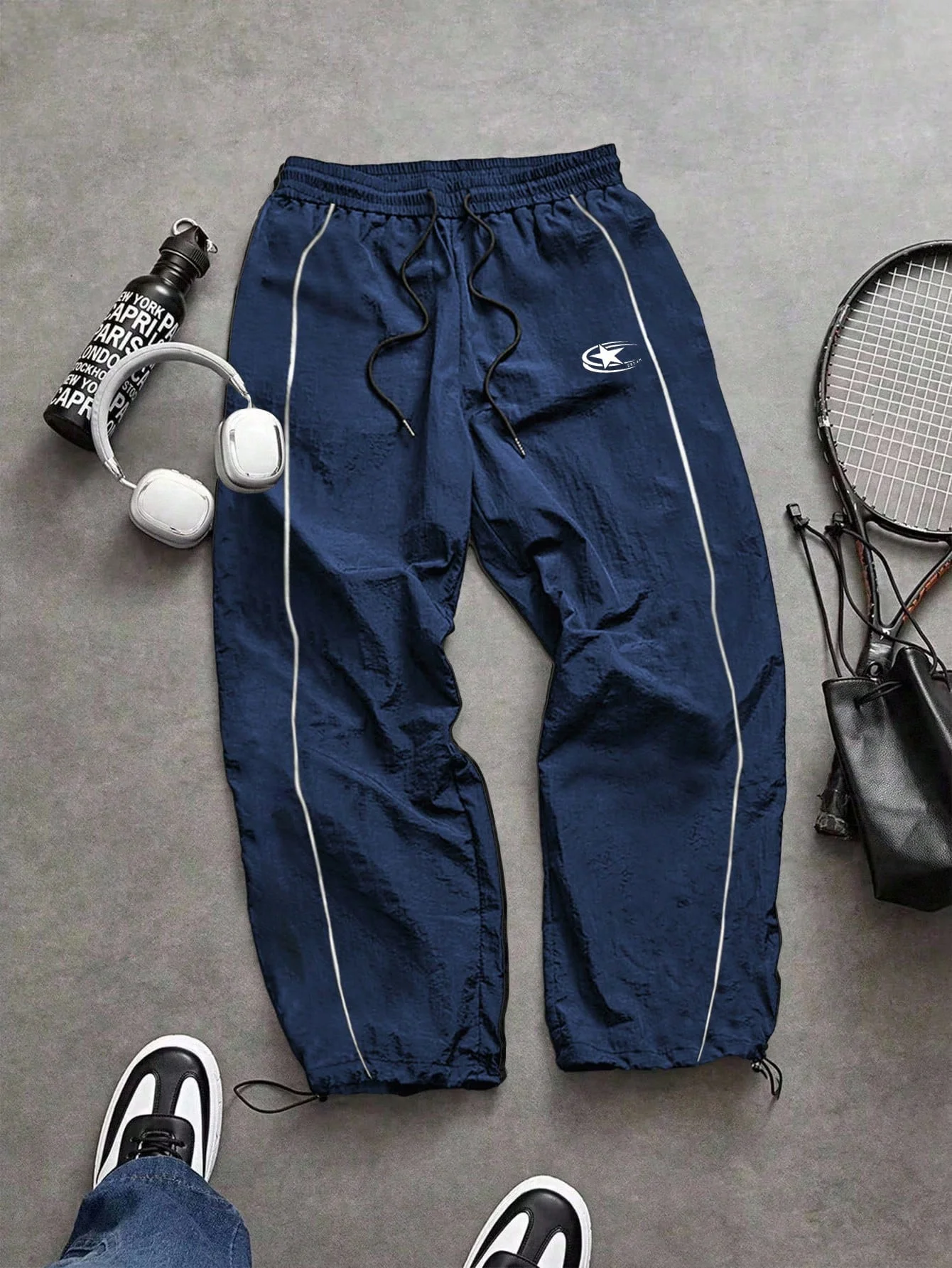 

Men's blue nylon sports pants casual street style loose fit waist drawstring side stripe sports jogging pants suitable for fitne