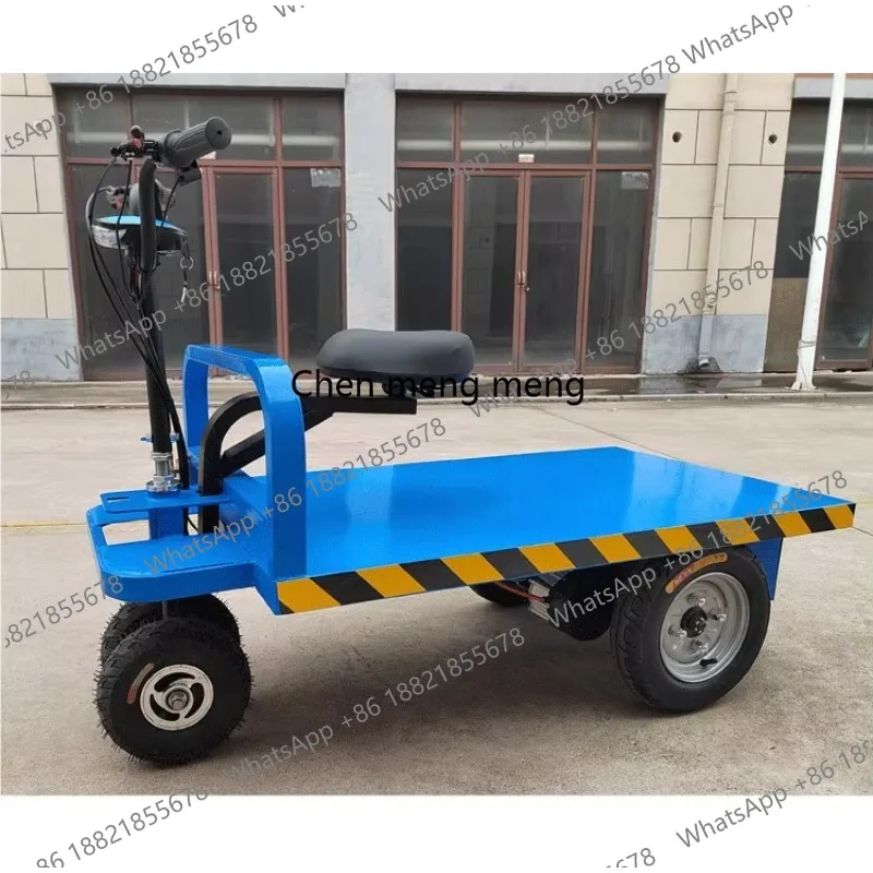 

Electric Three-wheeled Flatbed Car Is Riding Backwards and Forwards To Pull The Cargo Carrier Orchard Greenhouse Transport