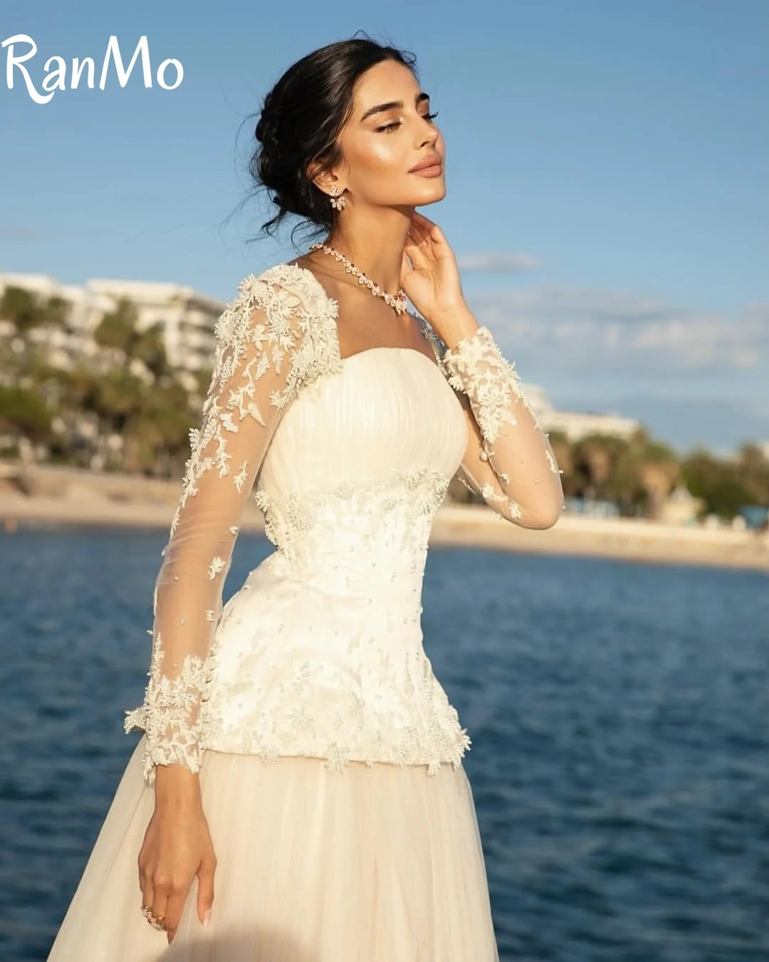 Ranmo 2025 فساتين زفاف رائعة بأكمام كاملة للنساء على شكل حرف a زي العرائس دانتيل لؤلؤ طول الأرض مخصصة فيستدوس دي نوفيا