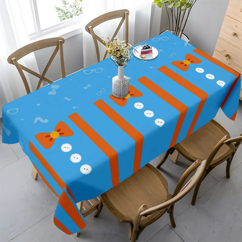 The elegant blue color paired with orange stripes and bow pattern tablecloth is very suitable for dining.
