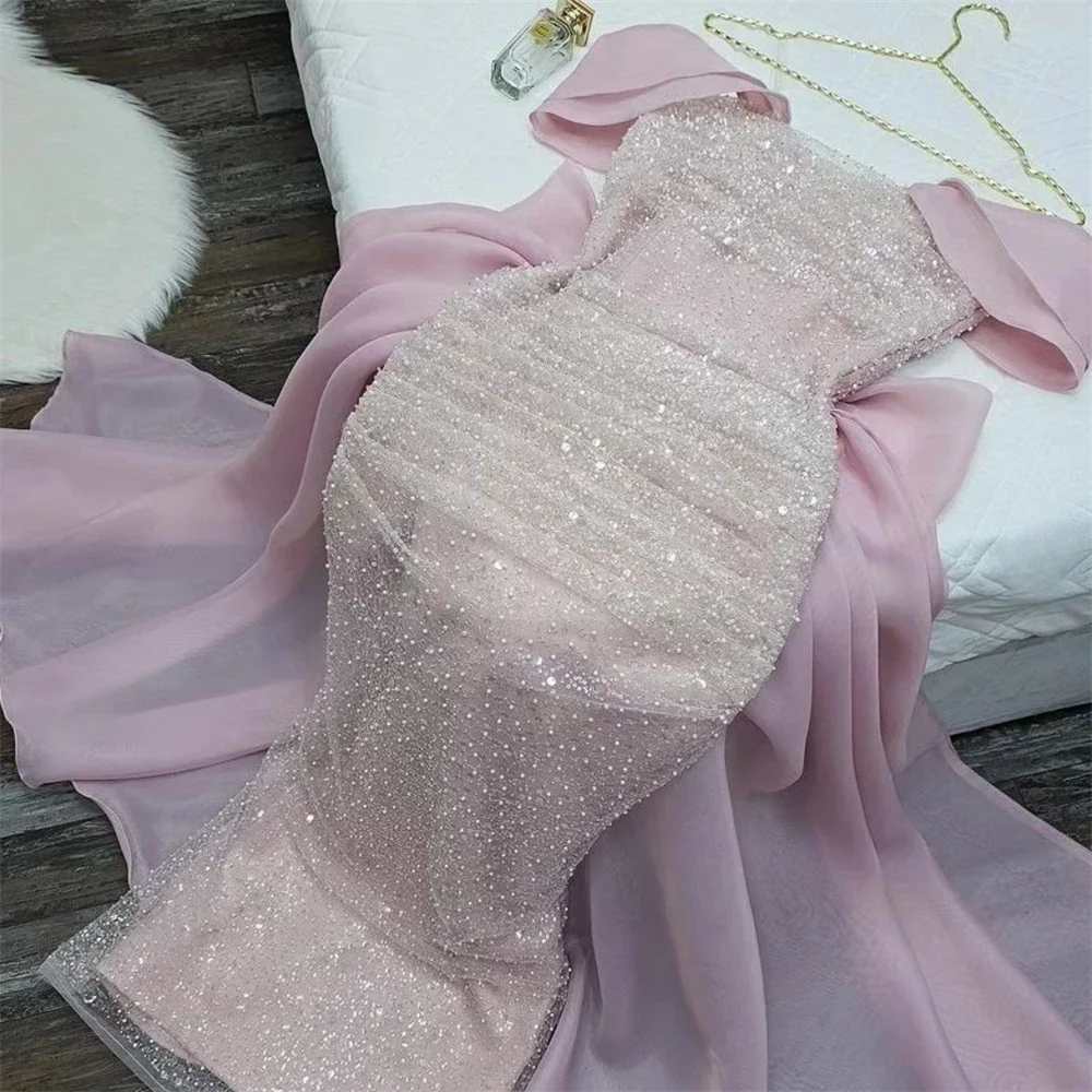 Yipeisha elegant off shoulder pink ball gown with a bow the back and sequins on the body, uniquely designed with dazzling colors