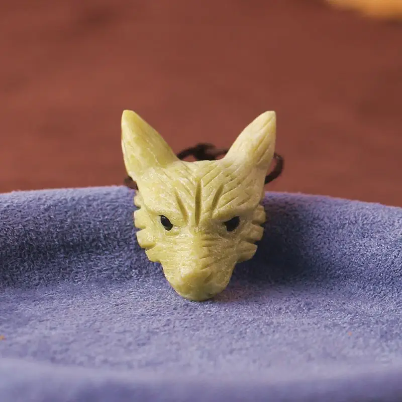 

Natural Yellow-Green Serpentine Wolf Head Pendant Hand-Carved Gemstone Sculpture with Brown Cord for Rustic Artisanal Jewelry