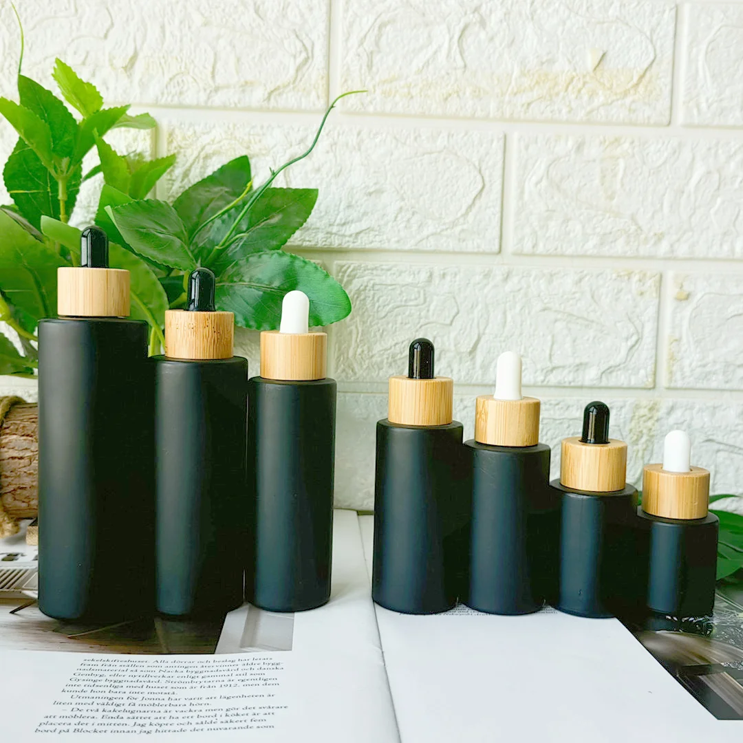 20 ml, 30 ml, 40 ml, 50 ml, 60 ml, 80 ml, 100 ml, leere Anti-Licht-Mattschwarz-Glasflasche mit Bambuskappen für Haaröle, flüssiges Serum, Tropfer