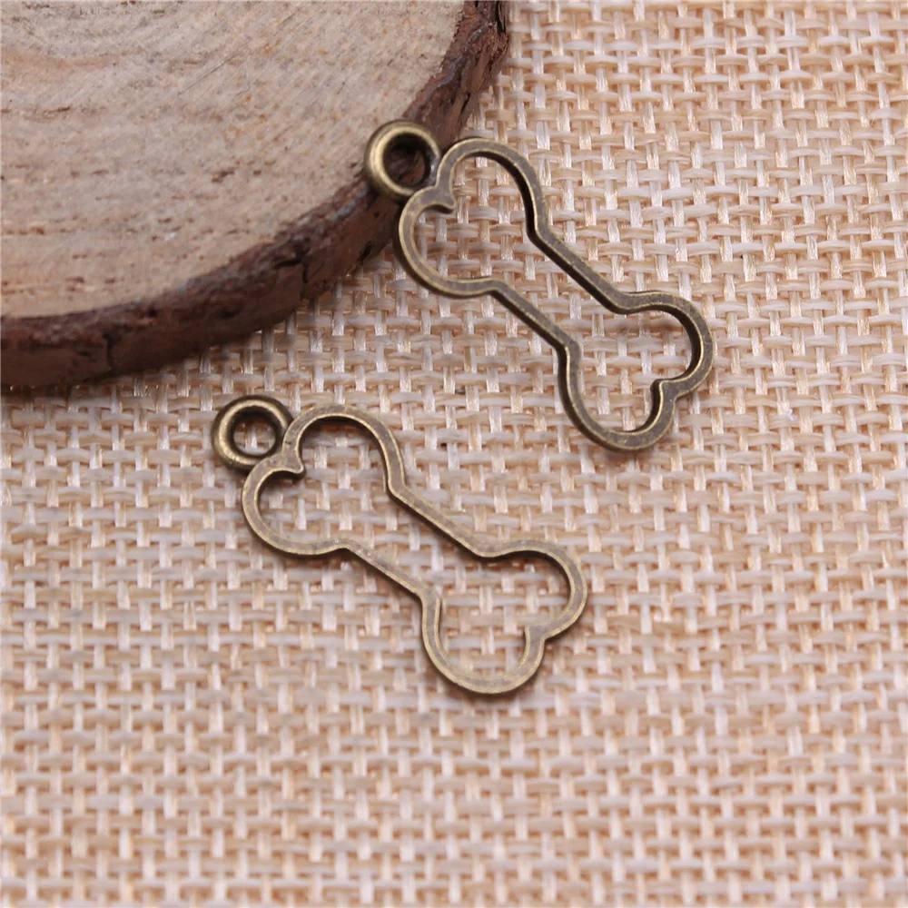 WYSIWYG 20pcs Charms Hollow Dog Bone 25x11mm Tibetan Bronze Silver Color Pendants Antique Jewelry Making DIY Handmade Craft