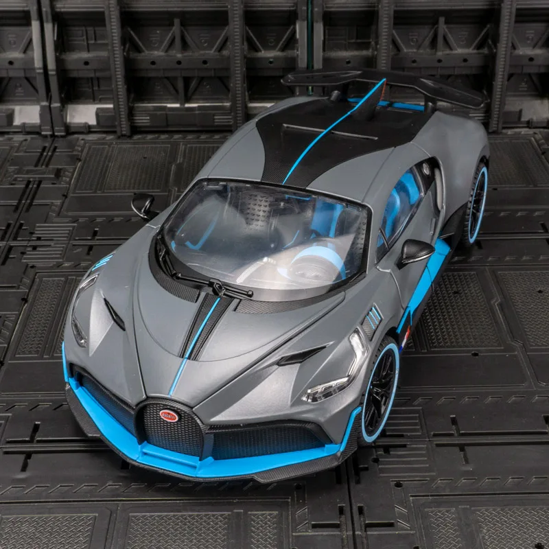

Супер модель спортивного автомобиля из сплава Divo 1:18, дверь автомобиля может открыть имеет функцию имитации звука и освещения, богатые детали.