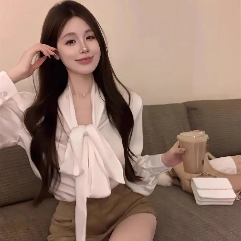 

2026 Autumn Winter New Women French Gentle Satin Shoulder Pads Long Sleeve Shirt Elegant Bow Design White Casual Fashion Blouse