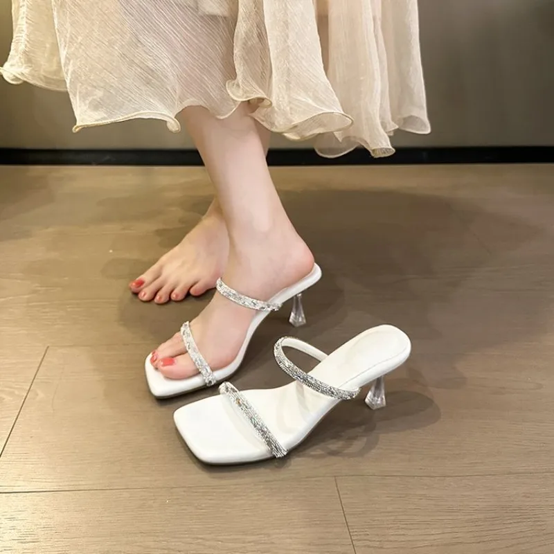 

2026 New Style Hollow Out Crystal Diamond Narrow Band Women Slippers Fashion Square Toe Thin Heels Shoes