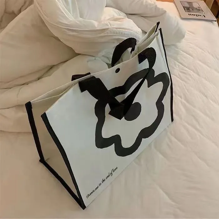 2023 borse per la spesa con fiori giapponesi Design di nicchia interessanti studentesse borsa portatile di protezione ambientale di grande capacità