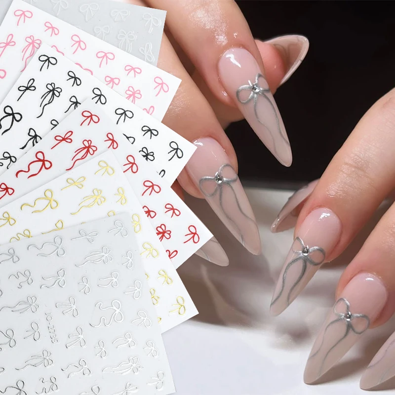 1pc ちょう結びネイルアートステッカー黒、白かわいいさまざまなフォームリボンデザイン自己粘着ネイルステッカー DIY マニキュア装飾