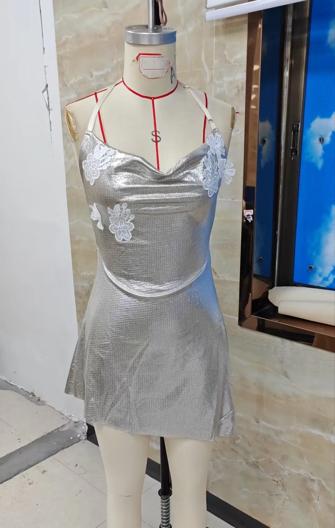 

Women's Halter Mini Dress Silver Metallic Asymmetrical Hem Sleeveless Backless Short Dress with White Floral Appliqués