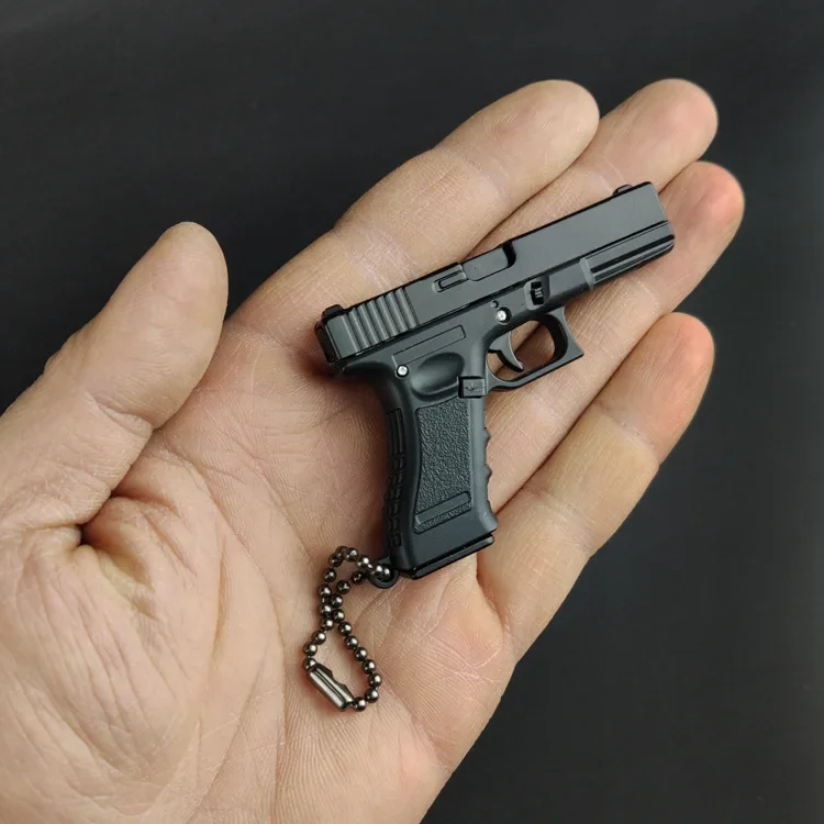 Imagem -03 - Glock G17 Liga Chaveiro de Plástico Mini Arma de Brinquedo Modelo Presente Pingente Ornamento Fidget Descompressão Brinquedo Anti-stress 1pc Novo 1:3