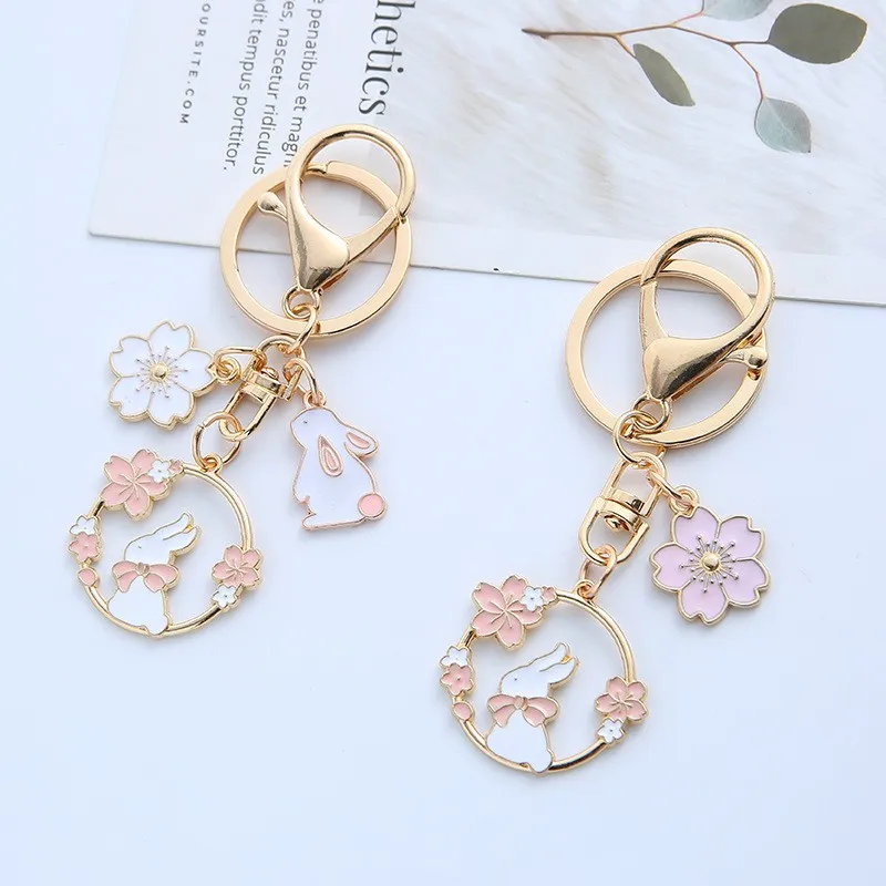 ins Japanese cute girl cherry blossom rabbit keychain cat pendant creative couple jewelry lanyard earphone pendant