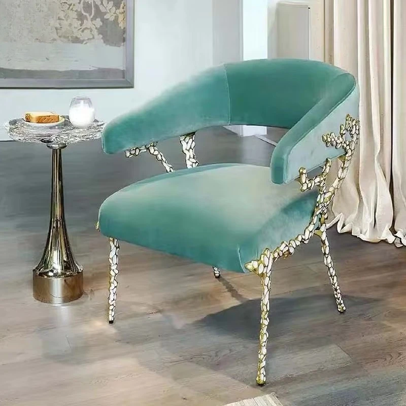 Velvet dining chairs with carved gold frames and modern style upholstered armchairs
