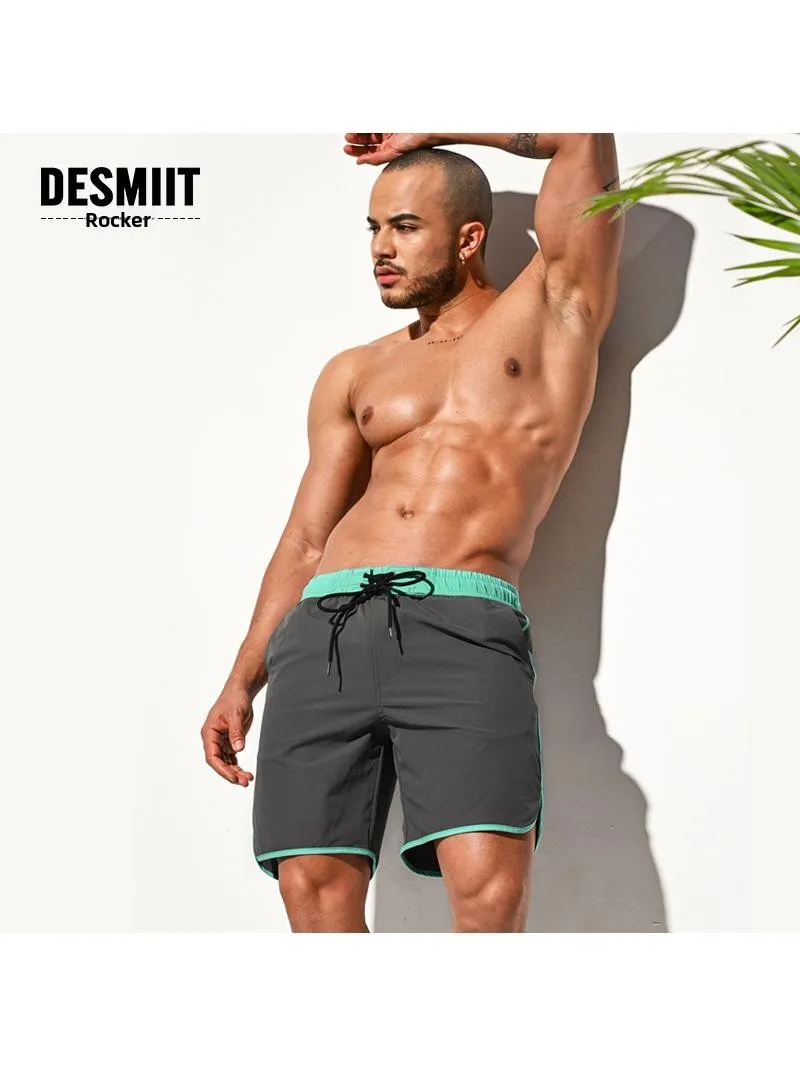 

Свободные удобные мужские пляжные орты Мягкие легкие повседневные брюки Глубокие глаза Четырехсторонние эластичные молодежные брюки восьминадцатилетней длины